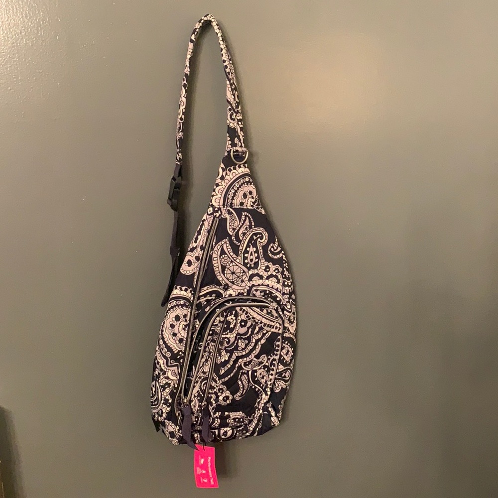NEW WITH TAGS VERA BRADLEY NAVY BLUE SLING BACKPACK with adjustable strap.